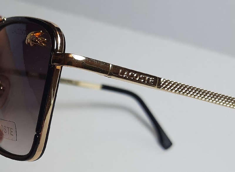 عینک آفتابی برند لاگوست مدل شیشه چهارگوش رنگ مشکی یووی 400
